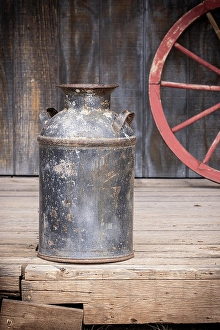 Rustic Prints: Still-life of old milk can and wagon wheel