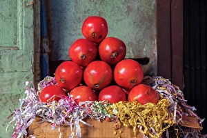Pomegranate Prints: Still-life of a pyramid stack of pomegranates in a market