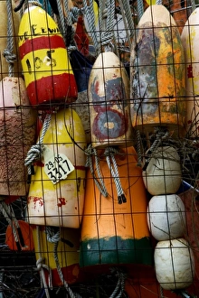 Images Dated 20th May 2007: Stock photo of bouys hung on a fence at a shipyard