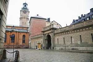 Chain Prints: Stockholm, Sweden - An old world road and buildings. There is a chained off area