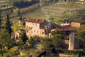 Images Dated 27th April 2004: Stone buildings perch on the vineyard-covered hills above the rural town of Lamole