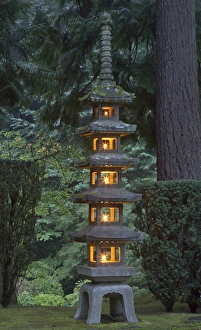 Stone lantern illuminated with candles, Portland Japanese Garden, Oregon