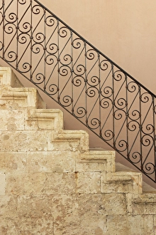 Stairway Prints: Stone staircase with ornate wrought iron balustrade. Greece, Crete, Chania