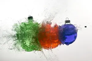 Ornament Prints: Stop action of Christmas ornaments filled with colored water and exploding form bullet
