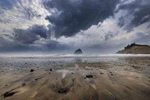 Stormy Prints: Storm clouds at low tide on beach at Cape Kiwanda in Pacific City, Oregon, USA