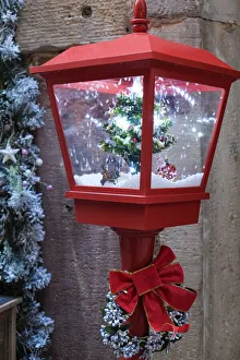 Alsace Prints: Strasbourg, France. Christmas red lamp post with blowing snow inside