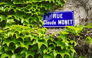 Normandy Prints: Street sign and ivy covered wall, Giverny, Normandy, France