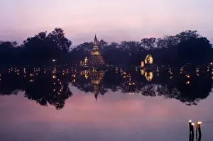 South East Asia Prints: Stupa at Sukothai historical site lit up with candles for Loi Krathong