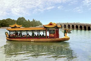 Images Dated 11th September 2007: The Summer Palace, Beijing, China, a traditional Dragon Boat passes the Seventeen