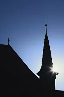 Images Dated 28th October 2005: Sun behind church steeple, Zurich, Switzerland