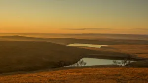 Sun just coming up over the Flint Hills with a light fog