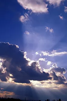 Sun rays radiate from the edges of the cloud