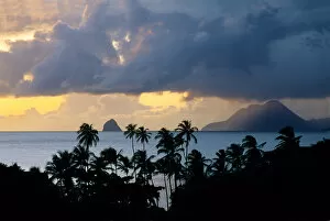 Images Dated 2nd October 2006: The sun sets behind Diamond Rock viewed from the island of Martinique in the Caribbean