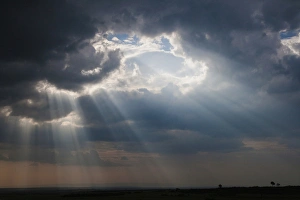 National Reserve Prints: Sunlight breaking through the clouds after thunderstorm, Masai Mara National Reserve