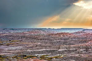 Badland Prints: Sunrays over striated, dramatic, badland hills