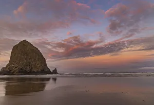 Images Dated 13th October 2021: Sunrise clouds over Haystack Rock in Cannon Beach, Oregon, USA