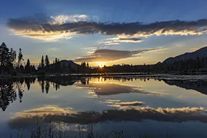Images Dated 25th July 2018: Sunrise clouds reflecting into Sprague Lake in Rocky Mountain National Park, Colorado