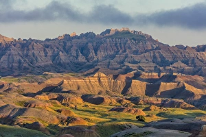 Great Plain Prints: Sunrise light breaks through on a foggy morning in Badlands National Park, South Dakota