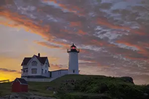 Sunrise skies over Nubble aka Cape Neddick Lighthouse in York, Maine, USA