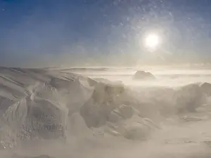 Eerie Prints: Sunrise and storm on the Breidamerkurjoekull a glacier of the Vatnajoekull NP during winter