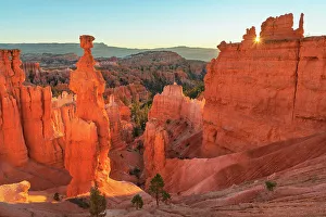 Sunrise view of Thor's Hammer and colorful hoodoos seen from below the canyon rim at Sunrise Point, Bryce Canyon National Park, Utah