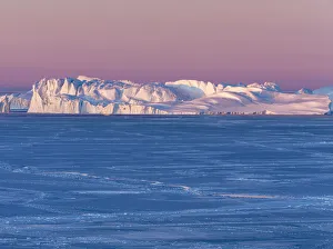 Images Dated 14th August 2020: Sunrise during winter at the Ilulissat Fjord, located in the Disko Bay in West Greenland