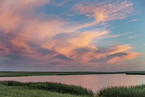 Medicine Lake National Wildlife Prints: Sunset clouds reflecting at Medicine Lake National Wildlife Refuge, Montana, USA