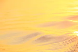 Images Dated 11th September 2013: Sunset colors and patterns on small waves in water