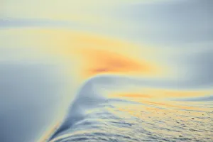 Images Dated 11th September 2013: Sunset colors and patterns on small waves in water