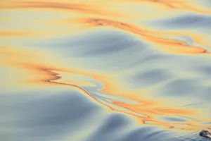 Images Dated 11th September 2013: Sunset colors and patterns on small waves in water