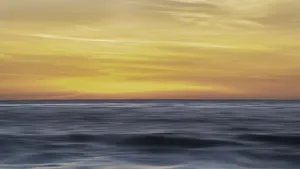 Images Dated 9th March 2018: Sunset colors in the sky over the smooth ripples of the ocean