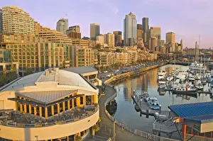 Sky Scraper Prints: Sunset light on Seattle, Washington skyline seen from Elliot Bay with boats in the foreground