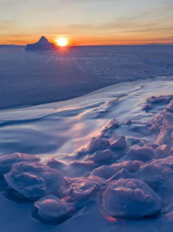 Images Dated 9th November 2020: Sunset at the shore of frozen Disko Bay during winter, West Greenland, Denmark