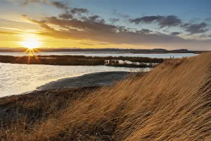 Images Dated 2021 April: Sunset skies at Freezeout Lake Wildlife Management Area near Choteau, Montana, USA