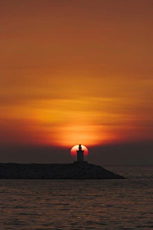Region Prints: Sunset view of lighthouse in Manila Bay, Manila, Philippines