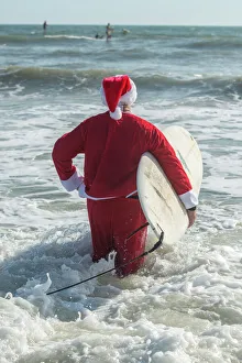 Surf Prints: Surfing Santas, surfboards, Cocoa Beach, Florida, USA