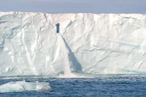 Svalbard, Nordaustlandet Island. Waterfalls cascade from the melting glacier