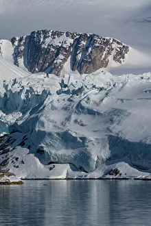 Images Dated 26th November 2023: Svalbard, Norway. Landscape of mountain, glacier and bay
