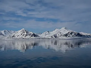 Images Dated 23rd January 2024: Svalbard, Norway. Landscape of mountain reflection and sky