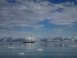 Images Dated 23rd January 2024: Svalbard, Norway. Rembrandt sailboat anchored in a scenic landscape