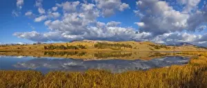 Reflecting Prints: Swan Lake reflects clouds and Gallatin Mountain Range in Yellowstone National Park
