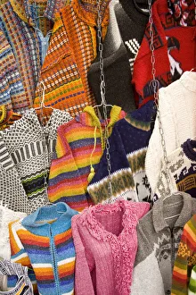 Images Dated 10th April 2007: Sweaters and ponchos on display at market, Plaza de San Francisco, Cuenca, Ecuador