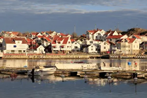 Orange Color Prints: Sweden, Bohuslan, Island of Tjorn. Views over Skarhamn fishing villages rooftops