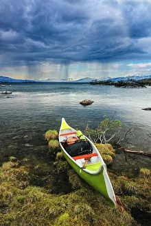 Fredrik Norrsell Prints: Sweden, Norrbotten, Abisko, Stordalen Nature Preserve. Canoe on shoreline of Torne Lake