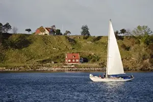 Skane Prints: Sweden, Skane, Isle of Ven. Sailboat passing Isle of Ven