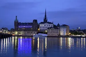 Swedish Prints: Sweden. Stockholm. The night view of Riddarholmen Island with the black spire of Riddarholmskyrkan