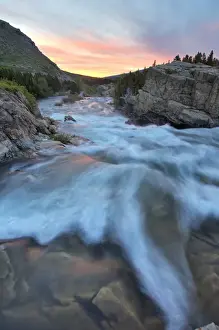 Images Dated 21st June 2008: Swiftcurrent Falls catches mornings first light in the Many Glacier Valley of Glacier