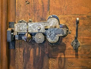 Switzerland, Bern Canton, Spiez, Spiez Castle, wood door with ornate hardware