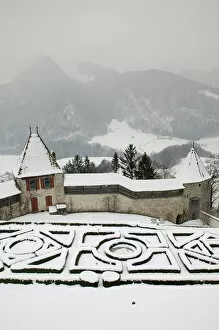 SWITZERLAND-Fribourg-GRUYERES: Castle Gardens under Snow: Gruyeres Castle / Winter