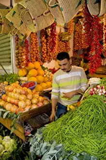 Moroccan Prints: Tangier Morocco Moroccan fruit & vegetable seller in stall at the covered market